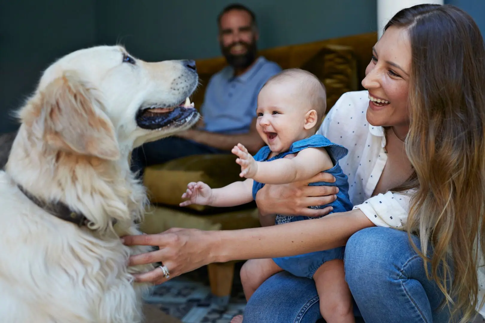 A group of people sitting around with a dog.